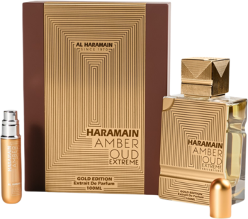 Zestaw perfum Haramein Amber Oud Gold Edition Extreme: złote pudełko, flakon i atomizer, na ciemnym tle.