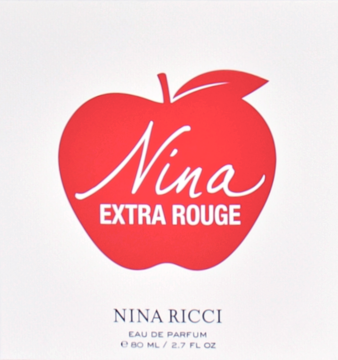Białe opakowanie perfum Nina Ricci Extra Rouge, z dużym czerwonym jabłkiem i nazwą produktu. Widok z przodu.