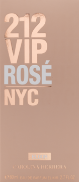 Przednie ujęcie różowo-złotego pudełka perfum 212 VIP Rosé NYC Elixir, z błyszczącymi i matowymi napisami.