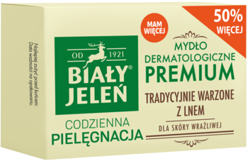 Biały Jeleń Mydło Premium dermatologiczne z lnem dla skóry wrażliwej. Kremowe opakowanie z zielonym logo, widok z przodu.