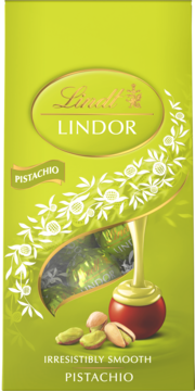 Limonkowe pudełko pralin Lindt Lindor Pistachio, widok z przodu, z grafiką wylewającej się masy i pistacji.