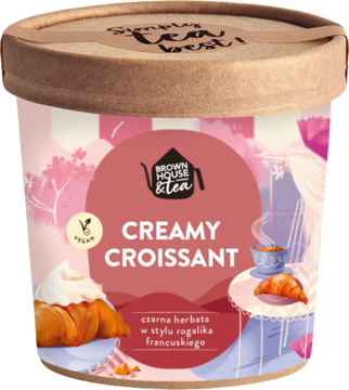 Cylindryczne opakowanie czarnej herbaty Brown House & Tea Creamy Croissant, różowe, wegańskie, widok z przodu.