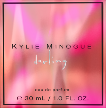 Kylie Minogue Darling eau de parfum 30 ml w różowym opakowaniu z gradientem i czarną ramką, widok z przodu.