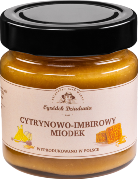 Miód cytrynowo-imbirowy Ogródek Dziadunia w szklanym słoiku z czarnym wieczkiem, widok frontalny.