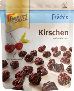Farmer's Snack Suszone czereśnie naturbeassen w torebce, z rozsypanymi owocami. Obok świeże czereśnie.