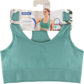 Miętowy sportowy biustonosz bezszwowy z żebrowanym dołem, na tekturowym wieszaku z wizerunkiem modelki.