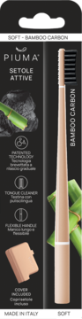 Szczoteczka Piuma Bamboo Carbon Soft z miękkim włosiem, na czarnym opakowaniu z zielonym bambusem, Made in Italy.