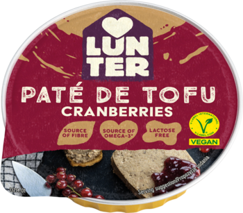 Okrągłe opakowanie wegańskiego pasztetu Lunter Tofu Cranberries. Czerwone wieczko, zdjęcie pâté i owoców.