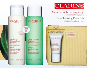 Clarins My Cleansing Essentials dla skóry tłustej: białe mleczko, zielony tonik, peeling w beżowej kosmetyczce.