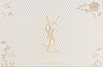 Eleganckie, jasne opakowanie zestawu Yves Saint Laurent Mon Paris z delikatnym wzorem, złotym logo YSL i kwiatami.