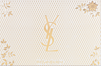 Front kremowo-złotego opakowania zestawu YSL Mon Paris, ze złotym logo YSL i delikatnym wzorem liści.