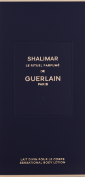 Granatowe opakowanie Guerlain Shalimar Sensational Body Lotion ze złotymi napisami, widok z przodu.