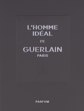 Guerlain L'Homme Ideal Parfum, ciemnoszara, teksturowana karta z nazwą męskich perfum L'Homme Idéal w bieli.