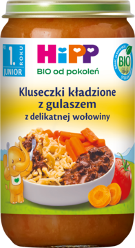 Słoik HiPP BIO Kluseczki kładzione z gulaszem wołowym dla dzieci po 1. roku życia, z zieloną etykietą.