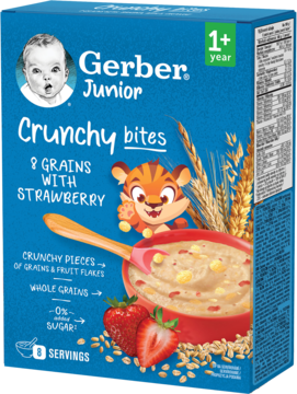 Niebieskie pudełko kaszki Gerber Junior Crunchy Bites 8 zbóż z truskawką (1+), z miską i ziarnami, widok z przodu.