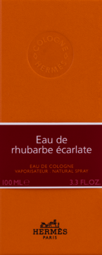 Pomarańczowe pudełko Hermès Eau de Rhubarbe Ecarlate, z ciemnym pasem i wytłoczonym logo, 100 ml.