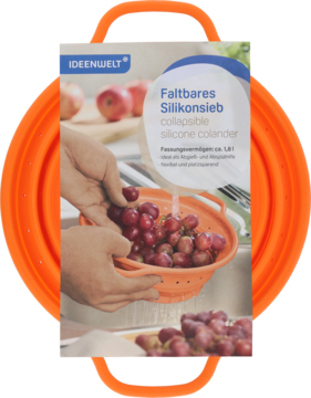 Pomarańczowy składany silikonowy durszlak z uchwytami, widok z przodu, z etykietą "Faltbares Silikonsieb".