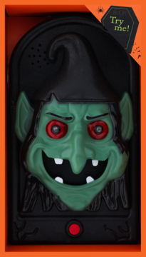 Halloweenowy dzwonek wiedźmy z zieloną twarzą i czerwonymi oczami, w pudełku z funkcją światła i dźwięku.