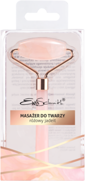 Ewa Schmitt masażer do twarzy z różowego jadeitu, w przezroczystym blistrze, na różowo-złotym tle.