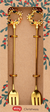 Dwie złote mini-widelce Eloy Christmas, z uchwytami w kształcie świątecznych wieńców, w ozdobnym opakowaniu.
