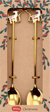 Dwie złote łyżeczki Eloy z białymi reniferami na końcówkach, w świątecznym kartonie z zielonym wzorem. Widok z przodu.