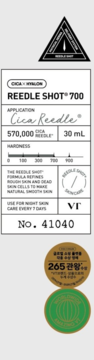 Etykieta boostera do twarzy VT Cica x Hyalon Reedle Shot 700, 570 000 mikroigieł, skala twardości. Widoczne pieczęcie.