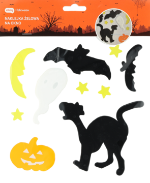 Halloweenowe żelowe naklejki na okno: czarne koty, nietoperze, biały duch, żółta dynia, ułożone na stole.
