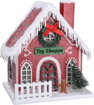 Czerwony domek świąteczny 'Toy Shoppe' z ośnieżonym dachem, zielonym wieńcem, białą bramką i figurką piernikowego ludzika.