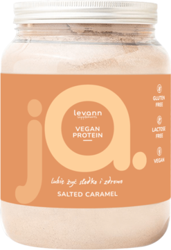 Levann Vegan Protein Słony Karmel, duży transparentny słój z białkiem, pomarańczowa etykieta 'ja.', widok z przodu.