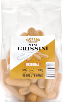 Ocelio Mini Grissini Original bezglutenowe, jasnobrązowe paluszki w przezroczystej torbie, widok z przodu.