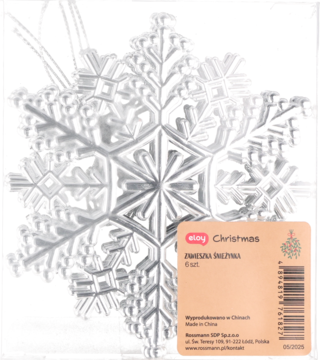 Srebrna, przezroczysta zawieszka świąteczna w kształcie fasetowanej śnieżynki, widok przez foliowe opakowanie.