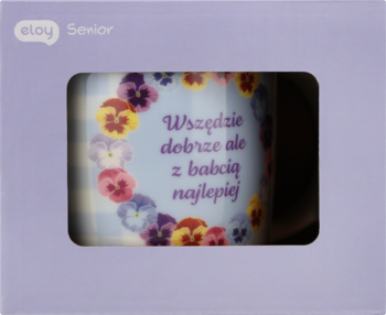 Obrazek/kartka z napisem "Wszędzie dobrze ale z babcią najlepiej", otoczony kolorowymi bratkami, na jasnofioletowym tle.