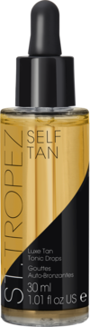 St.Tropez Self Tan Luxe Tan Tonic Drops w złotym szklanym flakonie z czarnym zakraplaczem, widok z przodu.