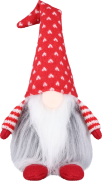 Siedzący, świąteczny krasnal w czerwonej czapce w białe serca i z długą, białą brodą.