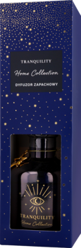Dyfuzor zapachowy Tranquility Home Collection w granatowym pudełku ze złotymi gwiazdkami, butelka z okiem słońca.