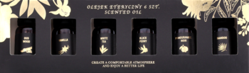 Zestaw 6 czarnych butelek olejku zapachowego 'SCENTED OIL' w pudełku ze złotymi zdobieniami roślinnymi.