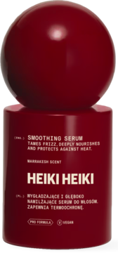 Ciemnoczerwone serum do włosów HEIKI HEIKI Smoothing Serum, błyszcząca butelka z kulistą nakrętką, przód.