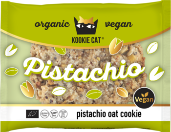 Kookie Cat Pistachio BIO wegańskie ciastko owsiane w zielonym opakowaniu z ziarnami pistacji, widok z przodu.