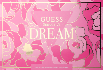 Różowe pudełko Guess Seductive Dream, zdobione złotymi różami i logo, zestaw zapachowo-pielęgnacyjny.