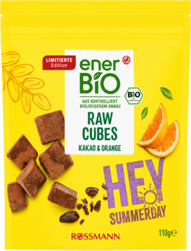 Żółta, limitowana edycja enerBiO RAW CUBES Kakao & Orange, z kostkami i plasterkami pomarańczy na opakowaniu.