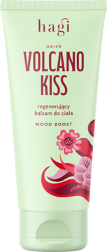 Hagi Volcano Kiss regenerujący balsam do ciała w jasnozielonej tubce, widok z przodu, z czerwonymi napisami i ilustracją kwiatów.