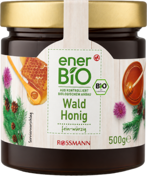 Słoik ciemnego miodu leśnego enerBiO 500g, z etykietą BIO z motywami sosny i plastra miodu, widok z przodu.