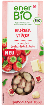 Nowe enerBiO ROSSMANN Erdbeer Stücke w białej jogurtowej czekoladzie, BIO. Różowe opakowanie, przód.