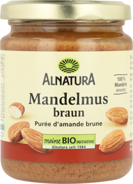 Alnatura Mandelmus braun, 100% brązowa pasta migdałowa w słoiku, widok z przodu, orzechy na etykiecie.