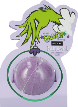 Fioletowa kula kąpielowa The Grinch Stolen Berries, z białym wzorem, w opakowaniu z zieloną dłonią Grincha.