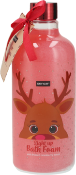 Różowa butelka pianki do kąpieli Sence Light up z motywem renifera, z zapachem mrożonej żurawiny i czerwoną wstążką.