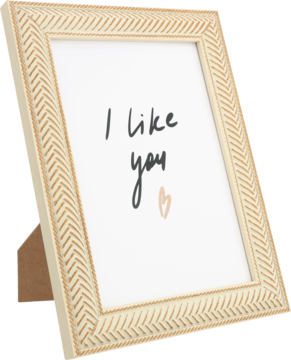 Jasno beżowa ramka na zdjęcie z reliefowym, wzorzystym brzegiem, stojąca pod kątem, z napisem 'I like you' i sercem.