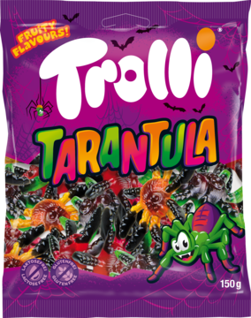 Fioletowa torebka żelków Trolli Tarantula, z rysunkowym pająkiem i napisem. Owocowe smaki, bez glutenu, bez laktozy.