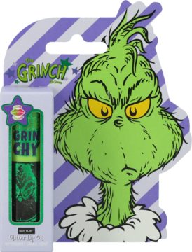 Grinch Glitter Lip Oil z ilustracją zielonego Grincha na fioletowym tle, obok przezroczysta tubka olejku.