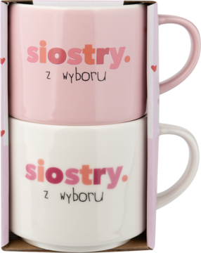 Eloy zestaw dwóch kubków, różowy i biały, z napisem 'siostry z wyboru', ułożone jeden na drugim w opakowaniu.
